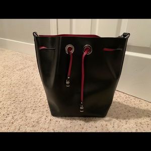 Used Zara bucket bag black exterior red interior